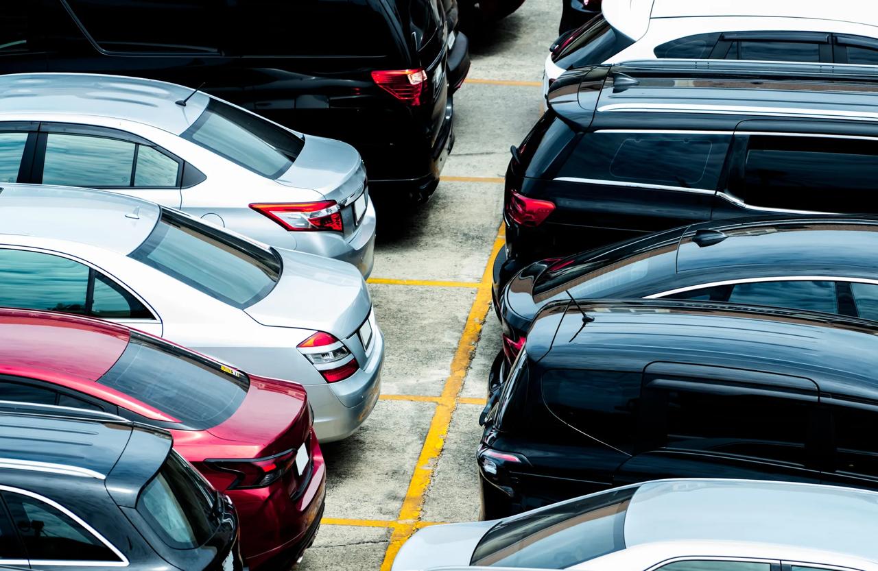 Car parked at parking lot of the airport for rental. Aerial view of car parking lot of the airport. Used luxury car for sale and rental service. Automobile parking space. Car dealership concept.